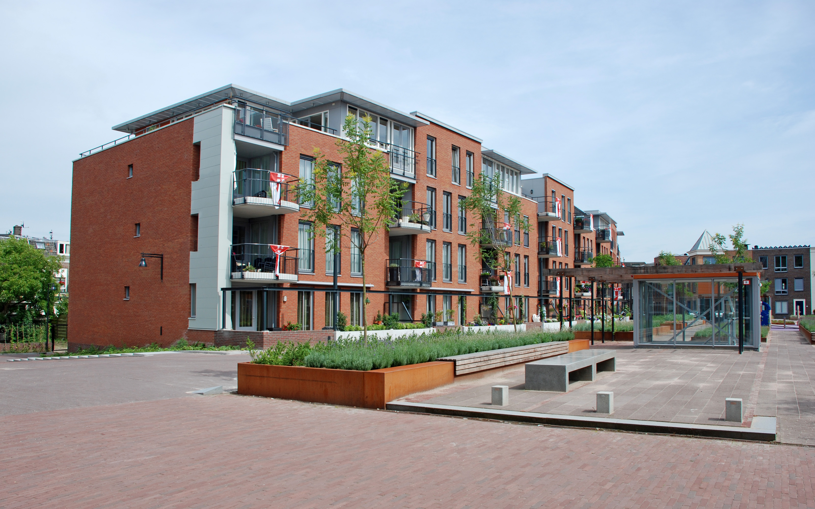 Residential brick buildings with vegetated courtyard